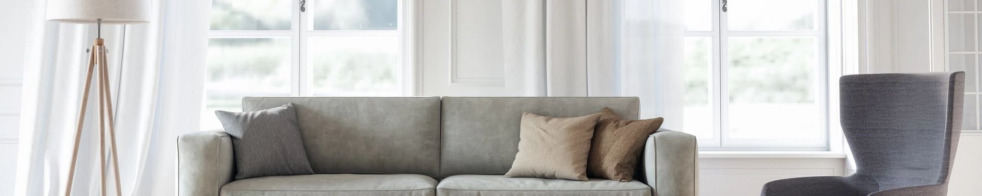 Bright living room with gray couch - More for the home from Wholesale Flooring and Blinds in Casper, WY